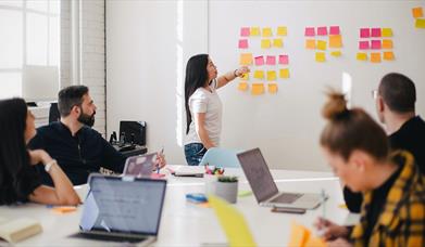 Woman leading a group meeting