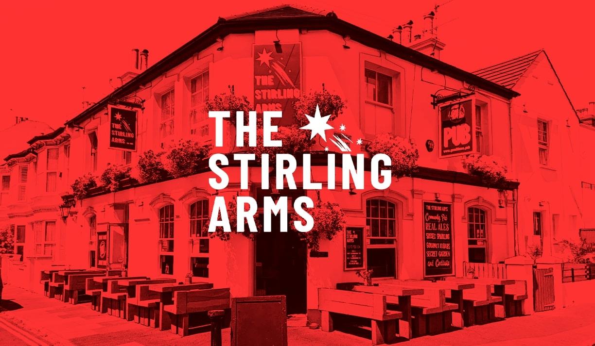 An image of The Stirling Arms bathed in a festive red glow. The text reads The Stirling Arms