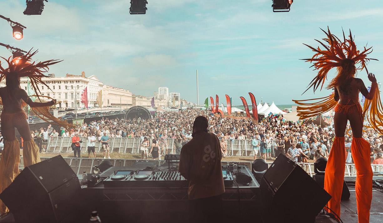 View of the crowd and performer taken from The Glorious Day Festival stage on Hove Lawns