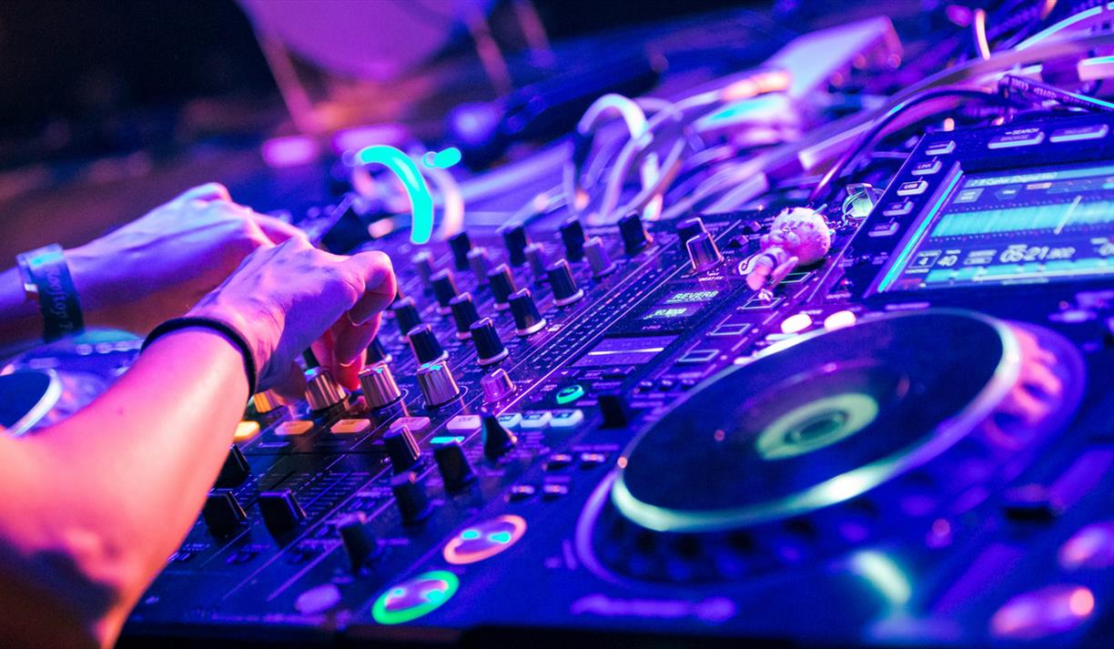 Large turntable in blue and purple lit club