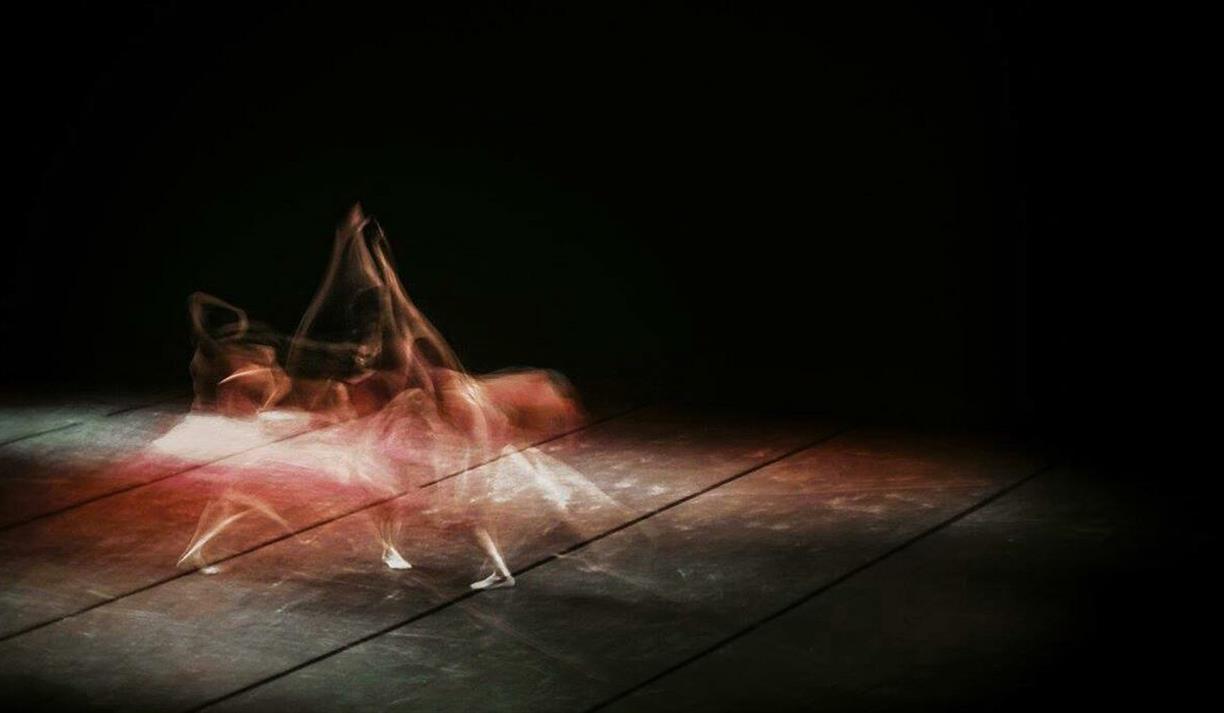 Long-exposure image of ballet dancer on a stage