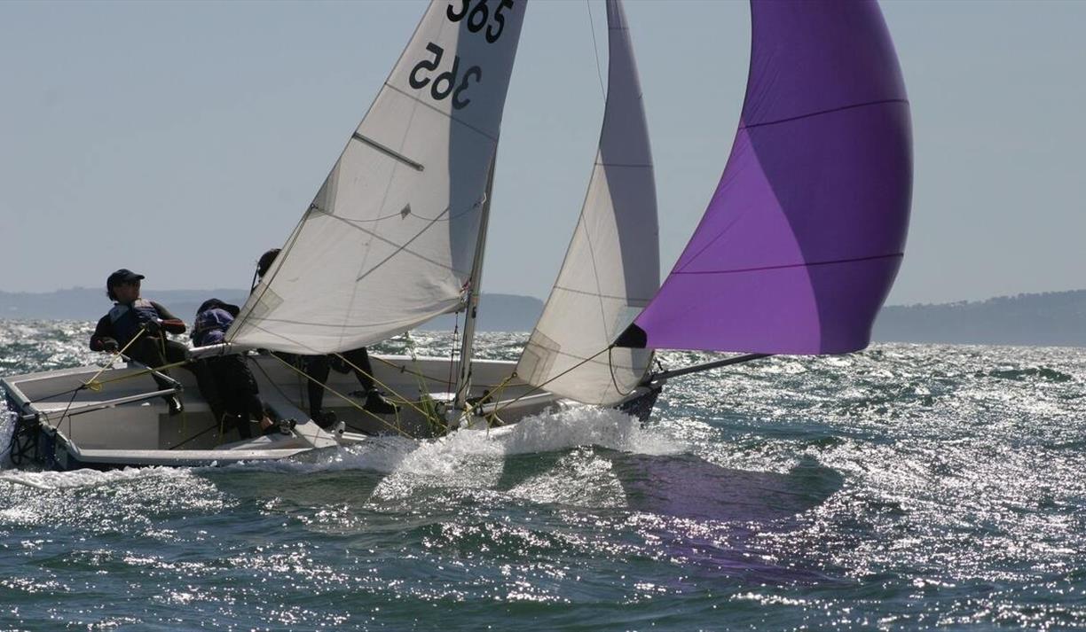Sailboat with people on the water