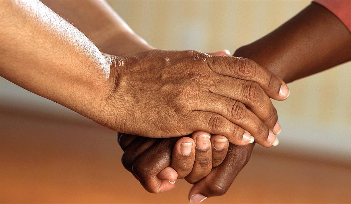 Two people holding hands