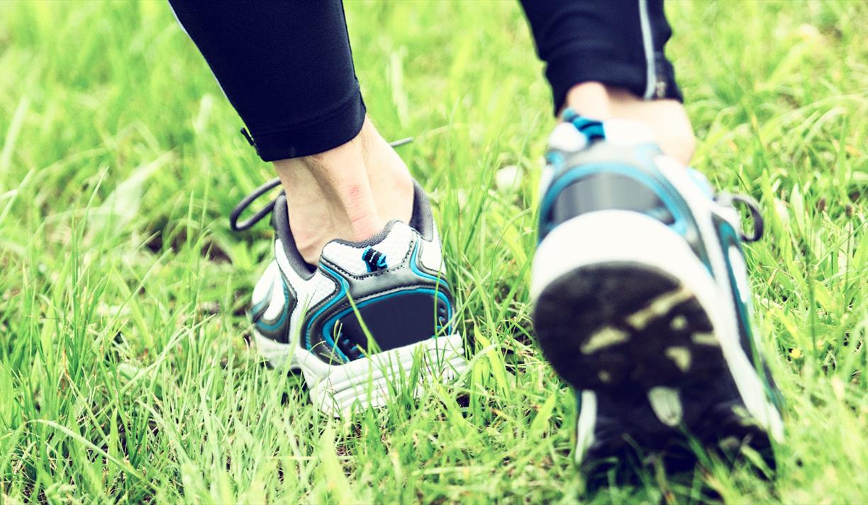 White, black and blue running shoes