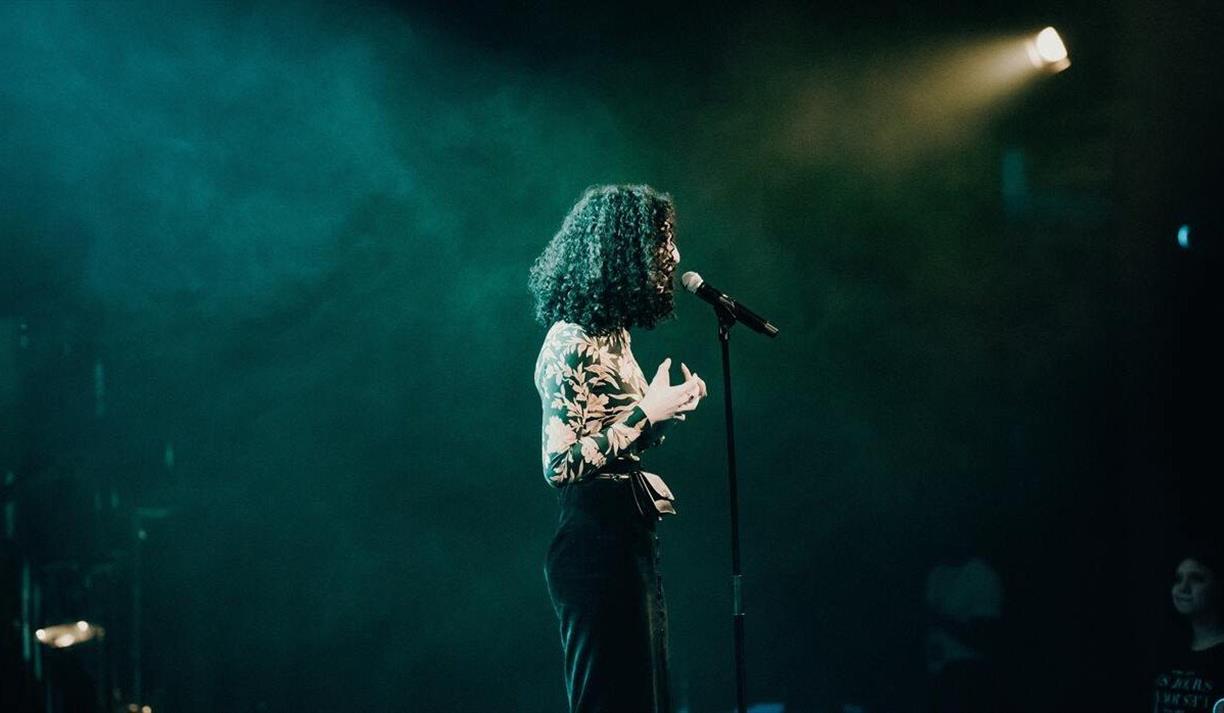 Woman speaking onstage