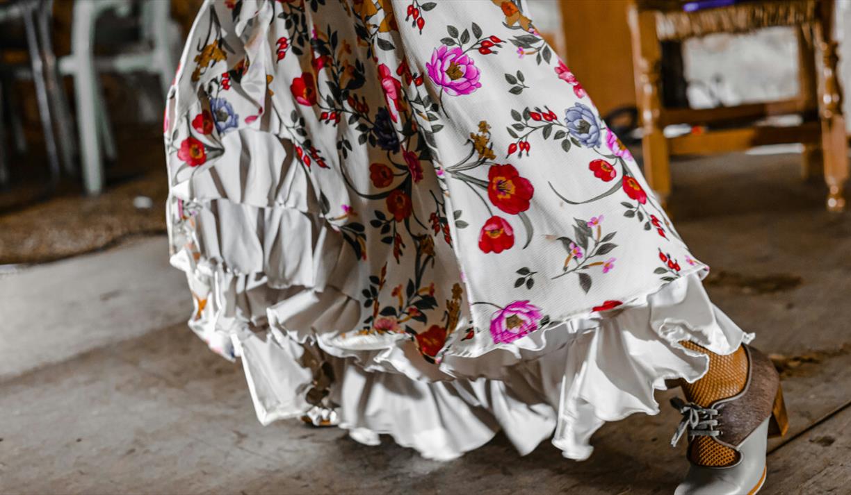White dress with ruffles and bright flowers