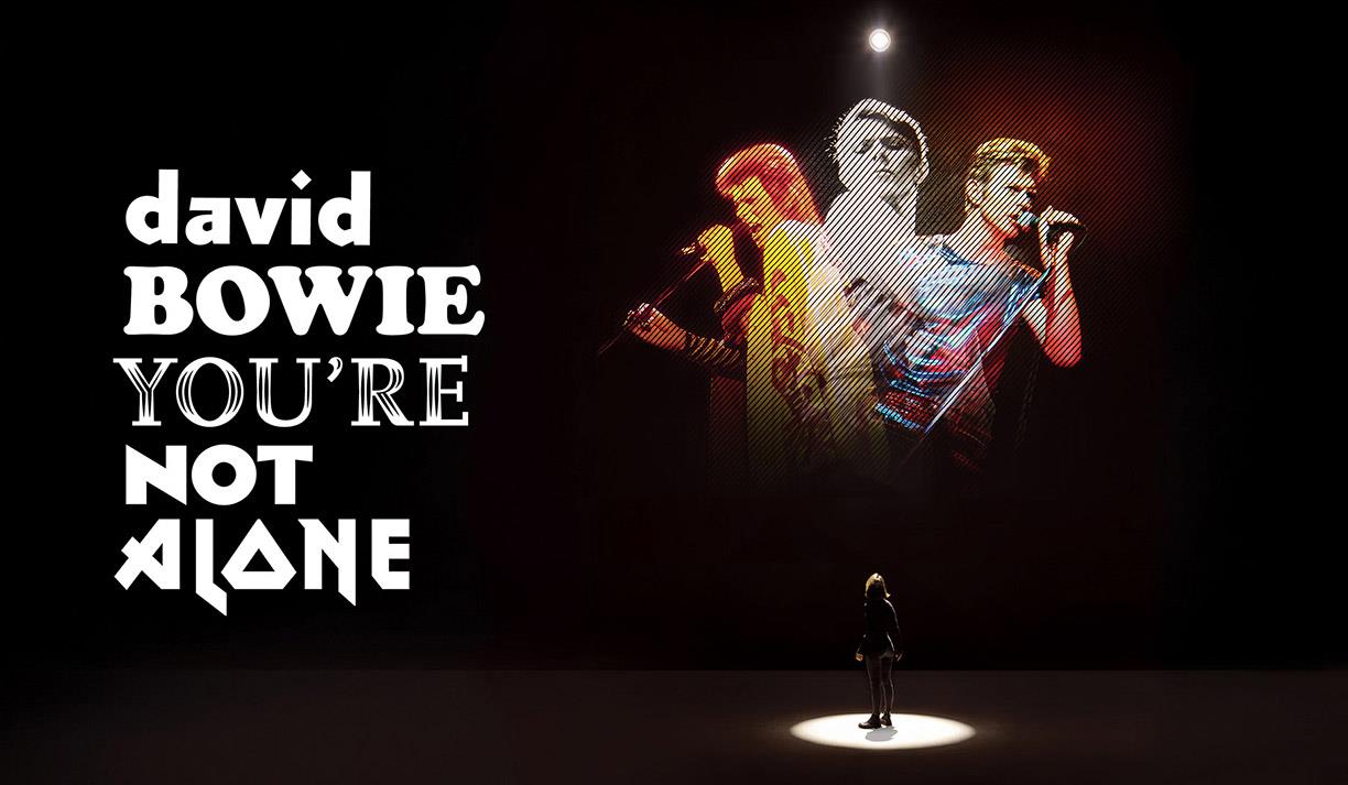 Promotional image for David Bowie: You're Not Alone featuring three images of the legendary star.
