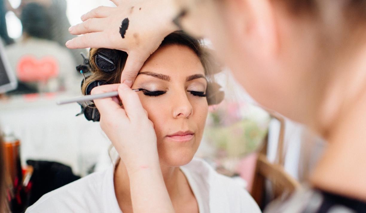 Eyeliner expertly being applied to a model's eyes