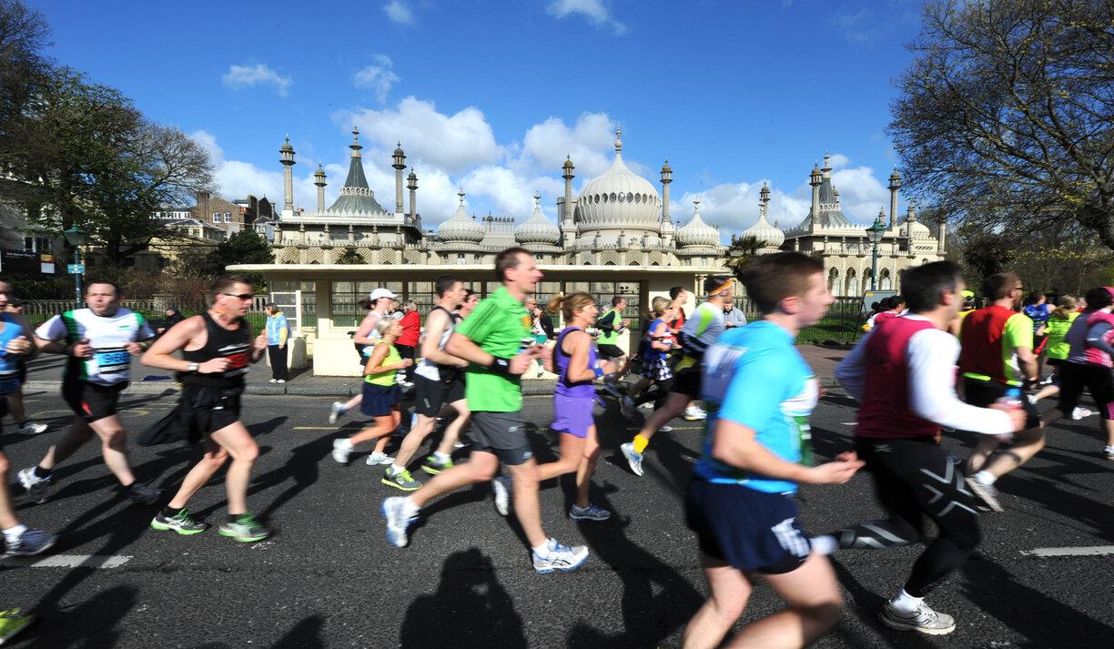 Brighton Marathon runners, going past the Royal Pavilion.