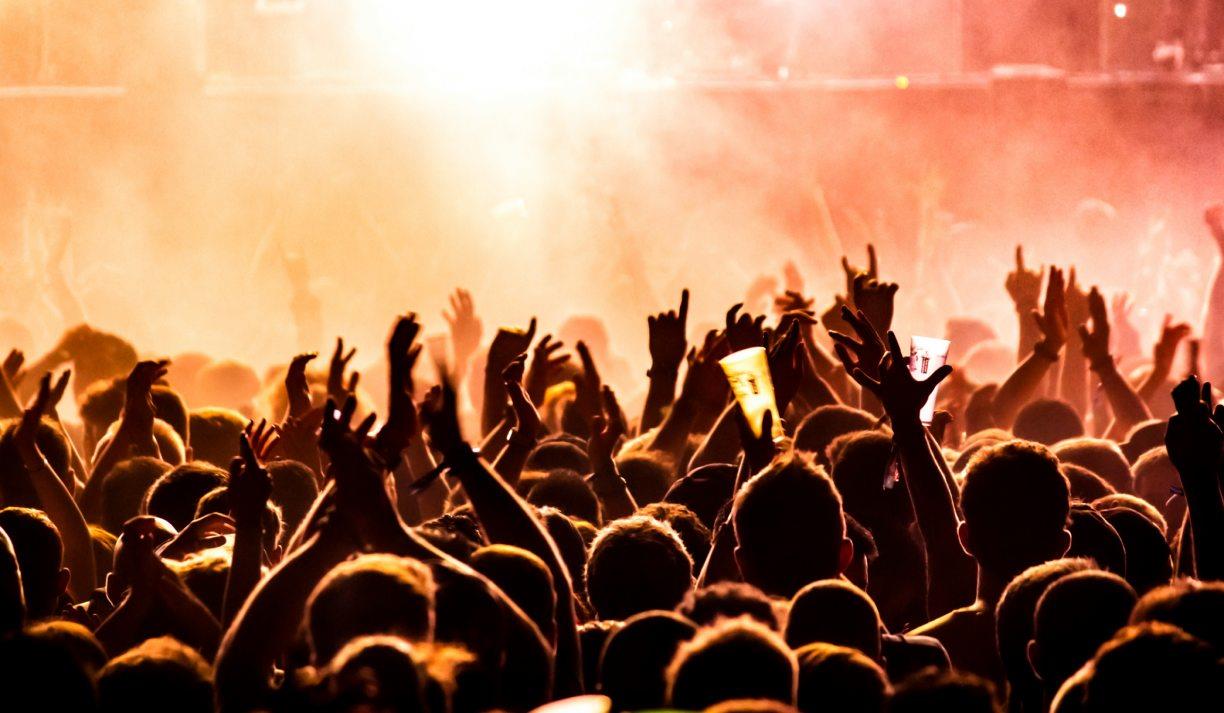 Photo of a crowd enjoying an event. The image was taken by Tijs Van Leur and was downloaded from the Unsplash website.