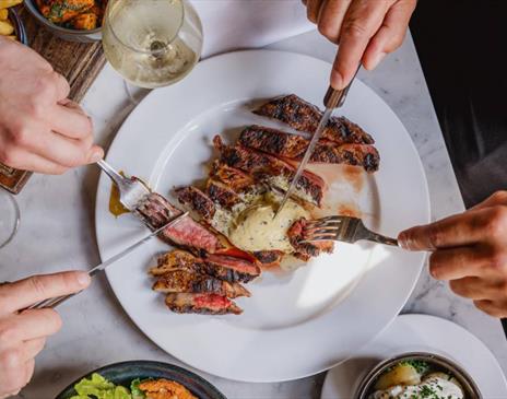 A sumptuous looking plate of steak.