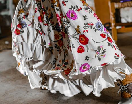 White dress with ruffles and bright flowers