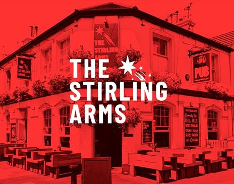 An image of The Stirling Arms bathed in a festive red glow. The text reads The Stirling Arms