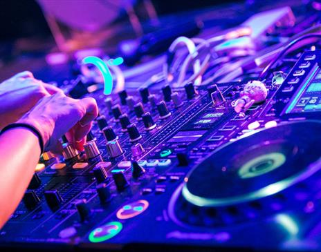 Large turntable in blue and purple lit club