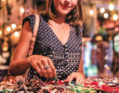 Woman browsing handmade crafts