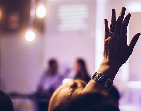 Hand raised to ask a question