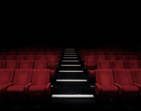 Empty red seats in a theatre