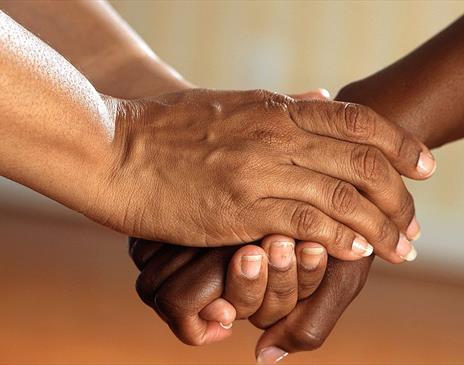 Two people holding hands