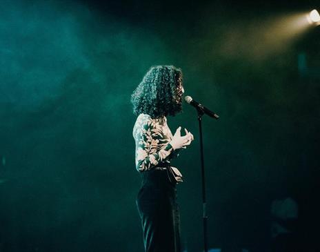 Woman speaking onstage