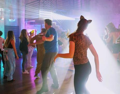 Costume dance party with bright lights