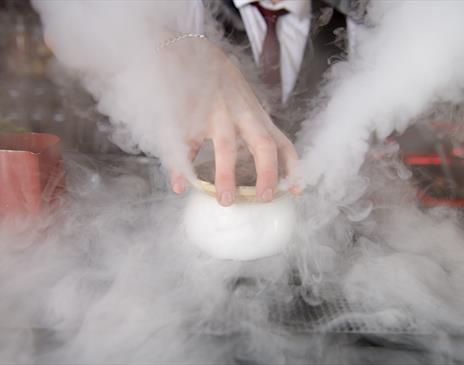 Steaming pot of food.