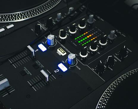 Black mixing desk with silver accents