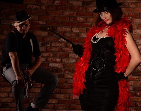 Man and woman in cabaret outfits