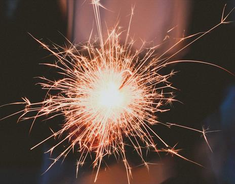 Person holding white sparkler