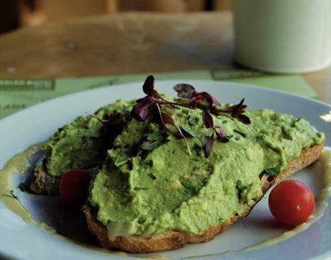 Smashed avocado on toast at Foodilic