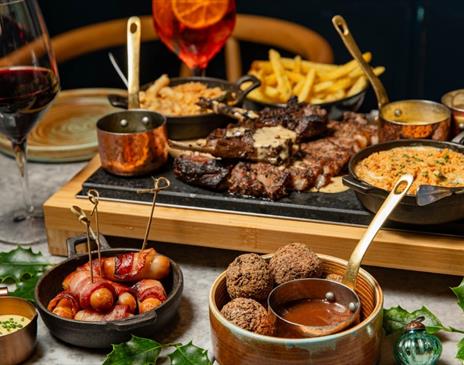 Dishes of delicious steak and sides at Kindling in Brighton