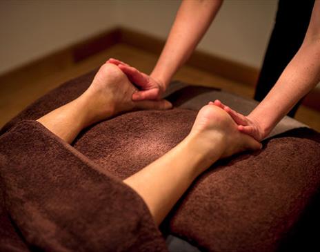 feet being massaged