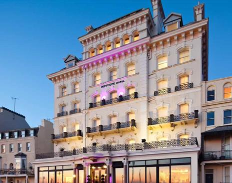 Exterior photo of the Mercure Brighton hotel taken at dusk
