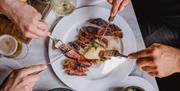A sumptuous looking plate of steak.