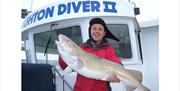 man with 25lb cod
