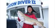 man with 25lb cod