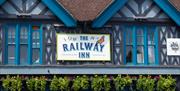 Close up of the sign on the outside of the Railway Inn pub