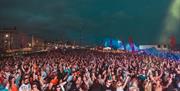 View of the crowd seen from The Glorious Day Festival stage on Hove Lawns