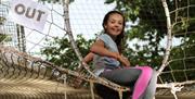 Branching Out Adventures - girl sitting by trampoline