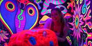 GLOBALLS - Lady near a neon cobra.