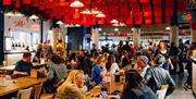 A busy Shelter Hall, Brighton in full service from their seven resident kitchens.