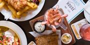 An aerial view of a selection of seafood and nachos on a table.