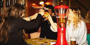 Diners cheering with beer