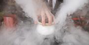 Steaming pot of food.
