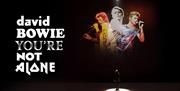 Promotional image for David Bowie: You're Not Alone featuring three images of the legendary star.