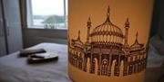 Bedroom image with a close-up of a Royal Pavilion lampshade.