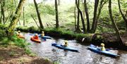 Canoeing down a stream