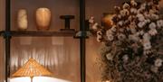 Close-up of flowers and lamp at the Field Trip Spa, Brighton