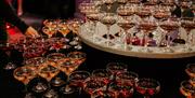 Glasses fill a round table, ready for a celebration at DoubleTree by Hilton Brighton Metropole