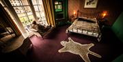 Betties Boudoir room with leopard print rug and furnishings.