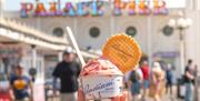 Tub of Badiani ice cream in front of the iconic Brighton Palace Pier
